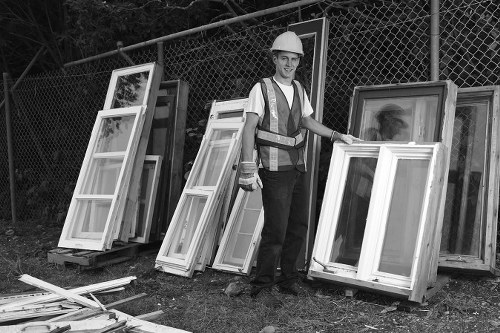 Construction site with builders managing waste