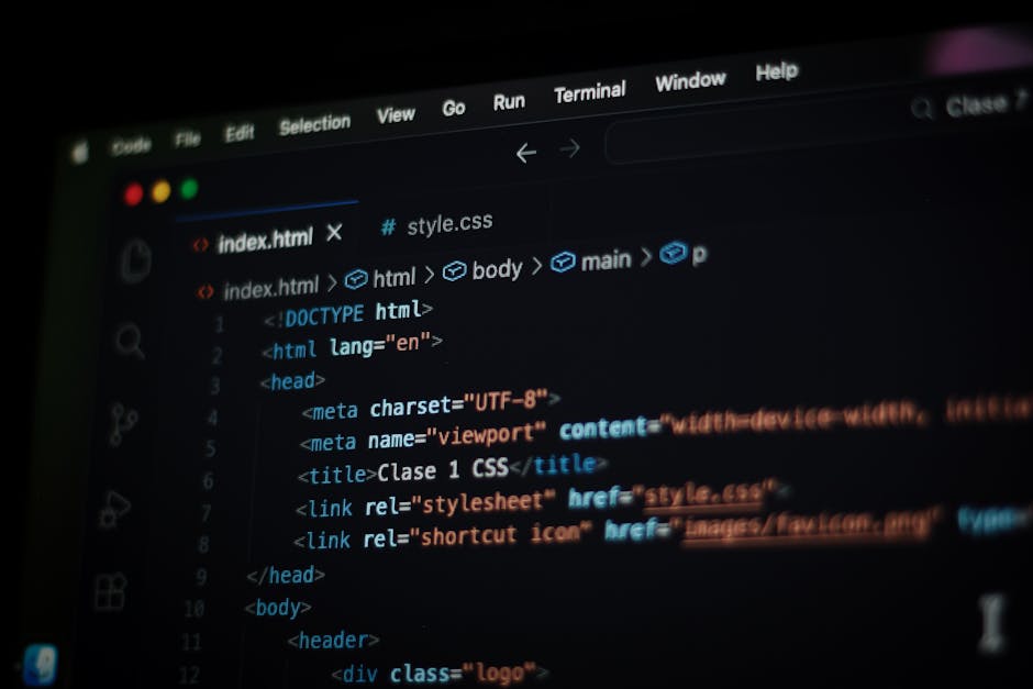A computer screen displaying a source code editor with an open HTML file named index.html. The code includes tags such as <html>, <head>, and <body>, with various meta tags, a title labeled 'Clase 1 C